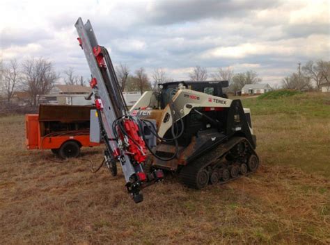 rotary drill skid steer|center rock skid steer attachment.